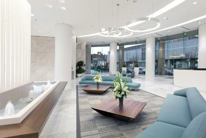 Modern interior workspace with natural lighting and panoramic views at Lake Merritt Plaza in Oakland.