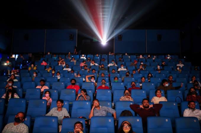 Movie audience enjoying a big screen cinema experience in India