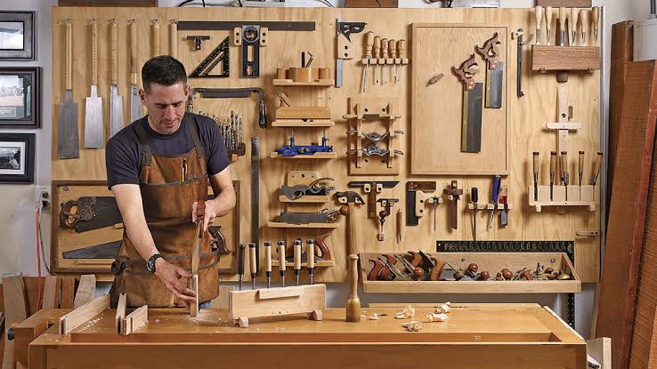 A well-organized professional woodworking retail showroom displaying high-end power tools and system cases.